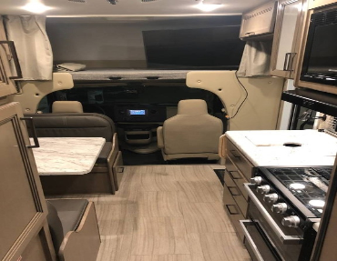 Spacious booth seating, a full kitchen, and overhead bunk space allow for plenty of room for everyone in this for sale by owner Thor motor coach that is a great value for the market