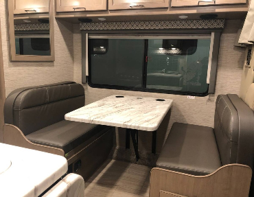 Booth seating with windows allows you to take in the views you traveled to see in this for sale by owner Thor Motor Coach great value for the RV market