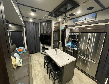 5th Wheel toy hauler has kitchen island and plenty of room to cook