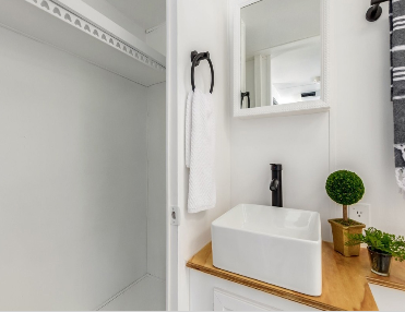 Aesthetically modernized bathroom, equipped with a skylight, plus a closet big enough to suit short or long journeys while glamping